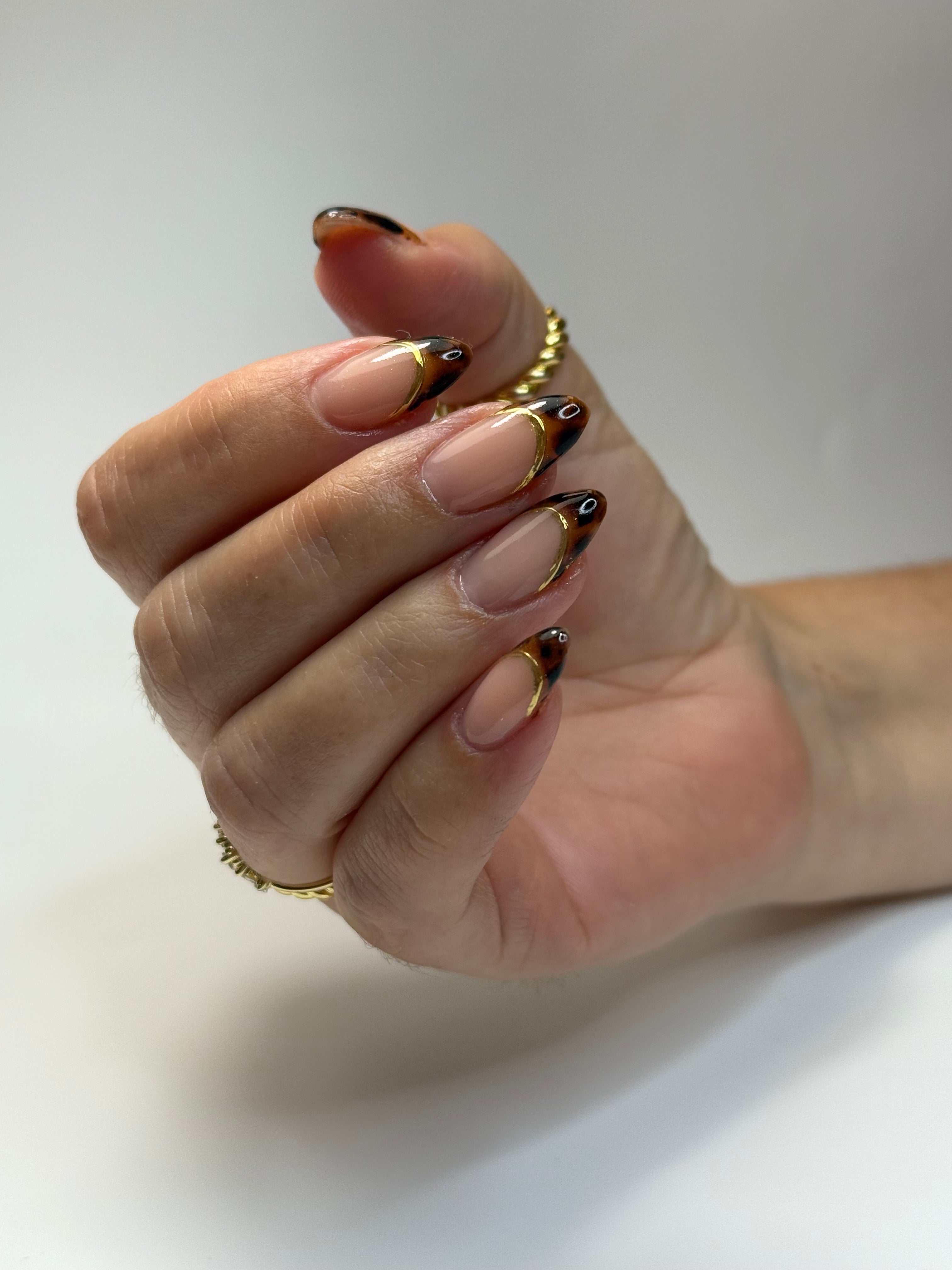 gold and leopard nail art almond shape nails