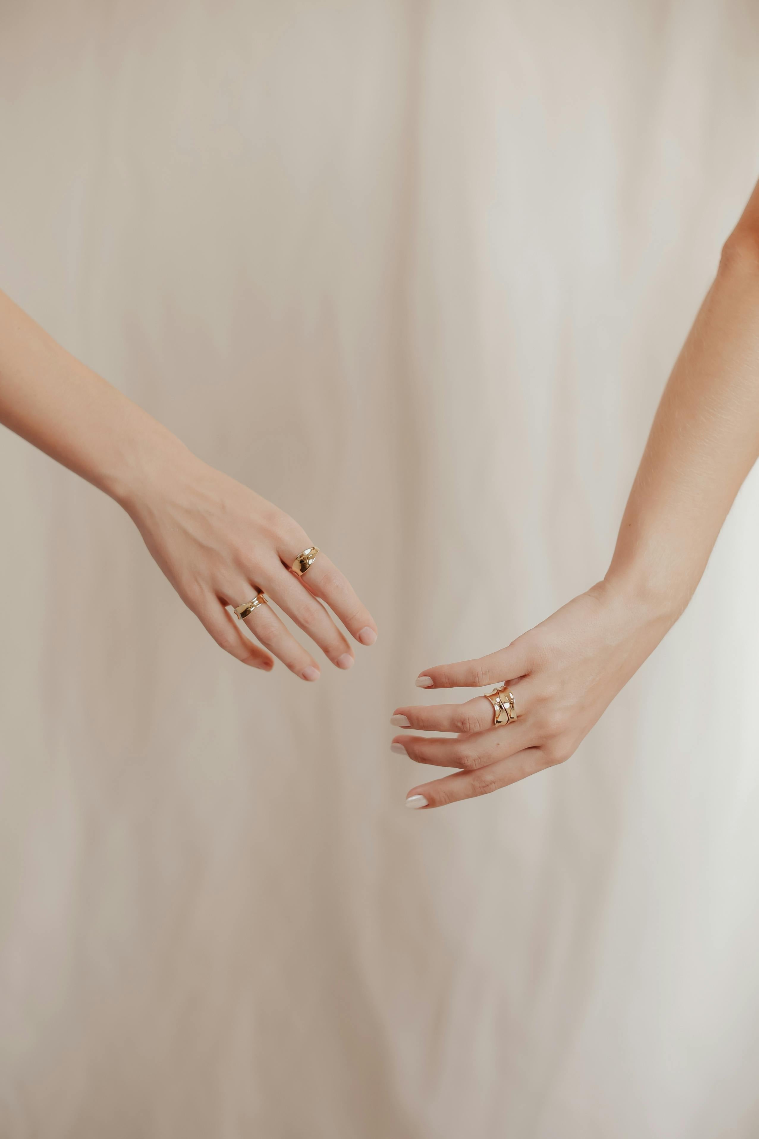 neutral manicured nails gold jewelry